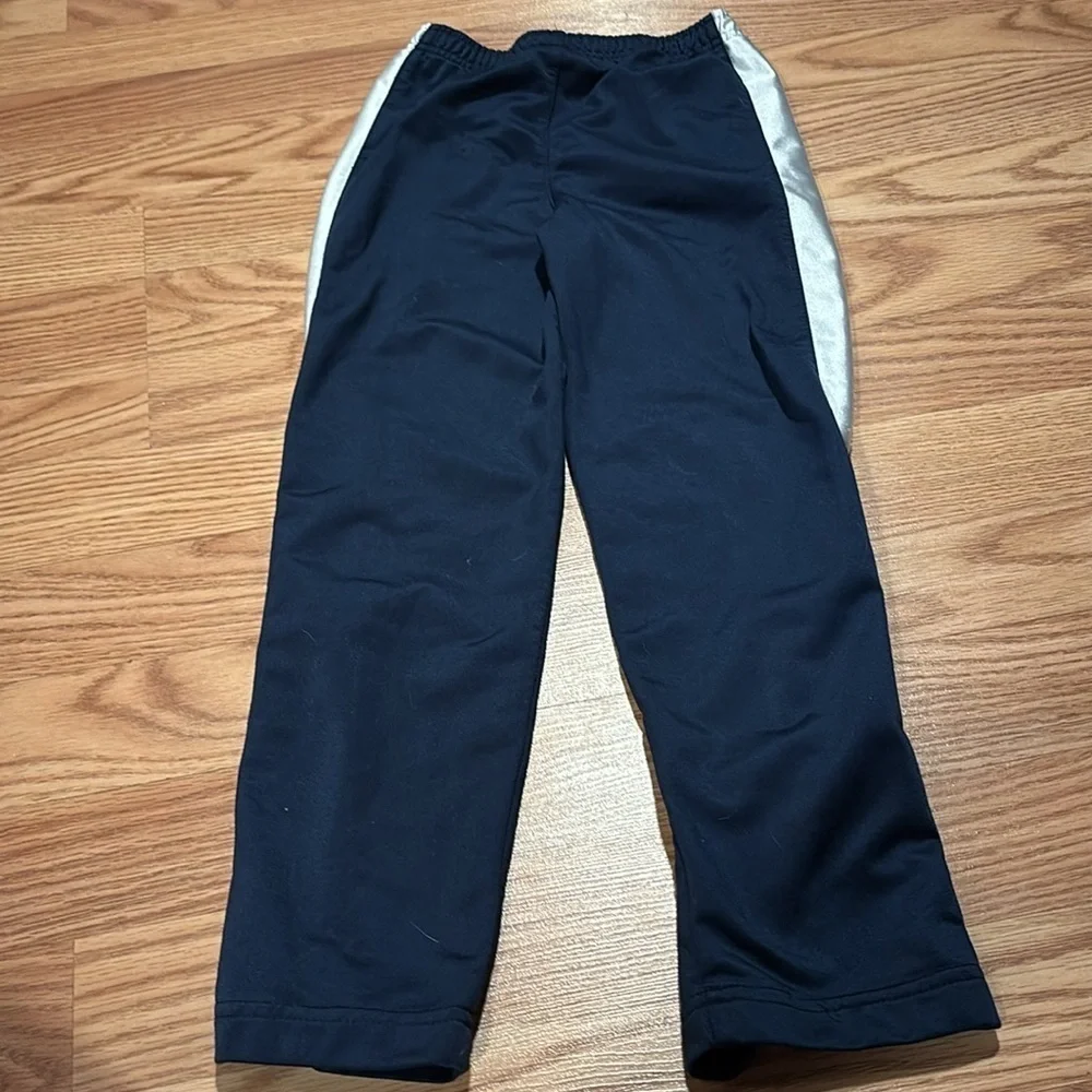 Size 6 Nike pants- blue with silver stripes. Athletic pants